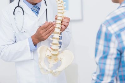 Dr. Zelony performing an at-work chiropractic adjustment